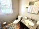 Bathroom featuring granite counters and tiled floors at 1305 Shakentown St, Knightdale, NC 27545