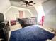 Bedroom with ceiling fan, soft carpet, and natural lighting at 1305 Shakentown St, Knightdale, NC 27545