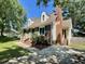 Charming brick home featuring dormer windows, green shutters, and a brick chimney at 1305 Shakentown St, Knightdale, NC 27545