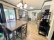 Eat-in kitchen featuring gray cabinets, stainless steel appliances, and a sliding glass door at 1305 Shakentown St, Knightdale, NC 27545