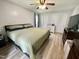 Main bedroom with neutral walls, wood floors, and a ceiling fan at 1305 Shakentown St, Knightdale, NC 27545