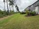 View of the community backyard with green grass and privacy trees, extending the outdoor space for relaxing at 136 Ashlar Ct, Cary, NC 27519