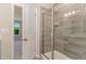 Bathroom featuring a glass enclosed shower with decorative tile at 136 Ashlar Ct, Cary, NC 27519