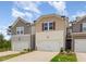 Charming townhome featuring neutral siding, a single-car garage, and well-manicured landscaping at 136 Ashlar Ct, Cary, NC 27519