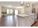 Open floor plan showing island, stainless appliances and sight lines to living area at 136 Ashlar Ct, Cary, NC 27519
