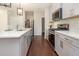 Modern kitchen features stainless steel appliances, an island and sleek countertops at 136 Ashlar Ct, Cary, NC 27519