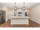 Modern kitchen with stainless steel appliances, central island and overhead pendant lighting at 136 Ashlar Ct, Cary, NC 27519