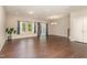 Spacious living area with hardwood floors, neutral walls, and large windows, creating a bright and welcoming atmosphere at 136 Ashlar Ct, Cary, NC 27519