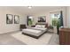 Comfortable main bedroom with carpet, natural light, and neutral walls at 136 Ashlar Ct, Cary, NC 27519