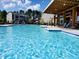 Inviting community pool surrounded by lounge chairs, providing a relaxing oasis for residents to enjoy during warm weather at 136 Ashlar Ct, Cary, NC 27519