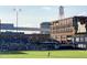 Scenic view of a baseball field with a water tower and buildings in the background at 1405 Watts St, Durham, NC 27701