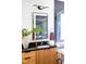 Modern bathroom with a wood vanity, black countertop, and a walk-in shower at 1405 Watts St, Durham, NC 27701