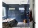 Luxurious bathroom featuring subway tile, a marble-clad tub, and modern fixtures at 1405 Watts St, Durham, NC 27701