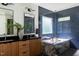 Stunning bathroom with double sinks, wood cabinets, and a modern design at 1405 Watts St, Durham, NC 27701