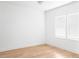 Bright bedroom featuring neutral walls and hardwood floors with natural light and windows at 1405 Watts St, Durham, NC 27701