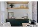 Bright home office featuring shelving with decor, a work area, and built in storage space at 1405 Watts St, Durham, NC 27701