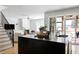 Open concept kitchen with an island, stainless steel appliances, and a view into the living room at 1405 Watts St, Durham, NC 27701