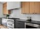 Well-equipped kitchen with stainless steel appliances, sleek countertops, subway tile backsplash, and stylish cabinets at 1405 Watts St, Durham, NC 27701