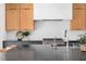Contemporary kitchen with light wood cabinets, dark countertops, and modern stainless steel appliances at 1405 Watts St, Durham, NC 27701