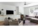 Cozy living room with a fireplace, comfortable seating, and neutral decor at 1405 Watts St, Durham, NC 27701