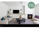 Modern living room featuring a cozy fireplace, contemporary furniture, and a 5.75% buydown advertisement at 1405 Watts St, Durham, NC 27701