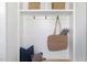 Stylish mudroom features built-in storage, hooks, and decorative woven baskets at 1405 Watts St, Durham, NC 27701