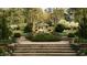 Picturesque park view with flower gardens and a gazebo surrounded by trees at 1405 Watts St, Durham, NC 27701