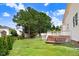 Manicured backyard featuring lush green lawn and mature trees at 1420 Lagerfeld Way, Wake Forest, NC 27587