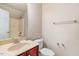 A well-lit bathroom featuring a vanity, toilet, and tub-shower combo at 1420 Lagerfeld Way, Wake Forest, NC 27587