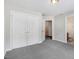 A bedroom featuring neutral walls and carpet, and a double closet at 1420 Lagerfeld Way, Wake Forest, NC 27587