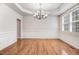Elegant dining room with hardwood floors, decorative trim, and stylish chandelier at 1420 Lagerfeld Way, Wake Forest, NC 27587