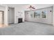 Inviting living room features neutral paint, carpet, fireplace, and abundant natural light at 1420 Lagerfeld Way, Wake Forest, NC 27587