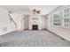 Spacious living room boasts neutral paint, carpeting, fireplace, and natural light at 1420 Lagerfeld Way, Wake Forest, NC 27587