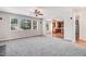 Open-concept living room features carpet, neutral paint, and connects to kitchen at 1420 Lagerfeld Way, Wake Forest, NC 27587