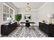 Bright home office featuring a modern desk, stylish decor, and large windows for plenty of natural light at 1420 Lagerfeld Way, Wake Forest, NC 27587