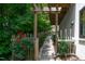 Backyard stone pathway with a wooden pergola and lush greenery providing a peaceful outdoor space at 1503 Hollywood St, Durham, NC 27701