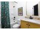 Bright bathroom with granite counters, stylish mirror, and tub-shower combination at 1503 Hollywood St, Durham, NC 27701