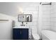 Stylish bathroom with a modern vanity, sleek mirror, and contrasting white tiles that enhance the room's bright, airy feel at 1503 Hollywood St, Durham, NC 27701
