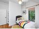 This bedroom offers a comfortable bed, natural light, and ample storage space at 1503 Hollywood St, Durham, NC 27701
