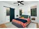 Bedroom features a gray upholstered bed with an attached modern bathroom through a sliding door at 1503 Hollywood St, Durham, NC 27701