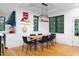 Spacious dining room with great natural light, wood table and modern light fixture at 1503 Hollywood St, Durham, NC 27701