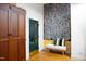 Welcoming entryway with a green door, wood floors, and decorative elements at 1503 Hollywood St, Durham, NC 27701