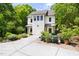 Stunning two-story home with a well-manicured lawn, driveway and lush greenery at 1503 Hollywood St, Durham, NC 27701