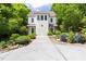 Two-story home featuring an ample driveway, a two-car garage and lush landscaping at 1503 Hollywood St, Durham, NC 27701