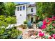 Charming two-story home with a cozy front yard featuring a fire pit and Adirondack chairs at 1503 Hollywood St, Durham, NC 27701