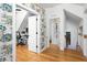 Hallway with dinosaur wallpaper that leads to an office and a Bedroom at 1503 Hollywood St, Durham, NC 27701