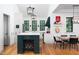 Modern kitchen with an island with a wine rack and white cabinets at 1503 Hollywood St, Durham, NC 27701