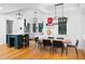 Bright kitchen features an island, modern appliances, and a dining area with hardwood floors at 1503 Hollywood St, Durham, NC 27701