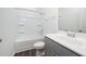 Bright bathroom with a shower-tub combo, white cabinets and chrome fixtures at 171 Piney Field Rd, Fuquay Varina, NC 27526