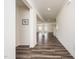 Entry hallway featuring hardwood floors, neutral walls, and an open view to the living spaces at 171 Piney Field Rd, Fuquay Varina, NC 27526
